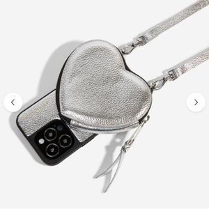Bandolier Silver Heart-Shaped Phone Case with Strap for iPhone 14 Pro Max.
